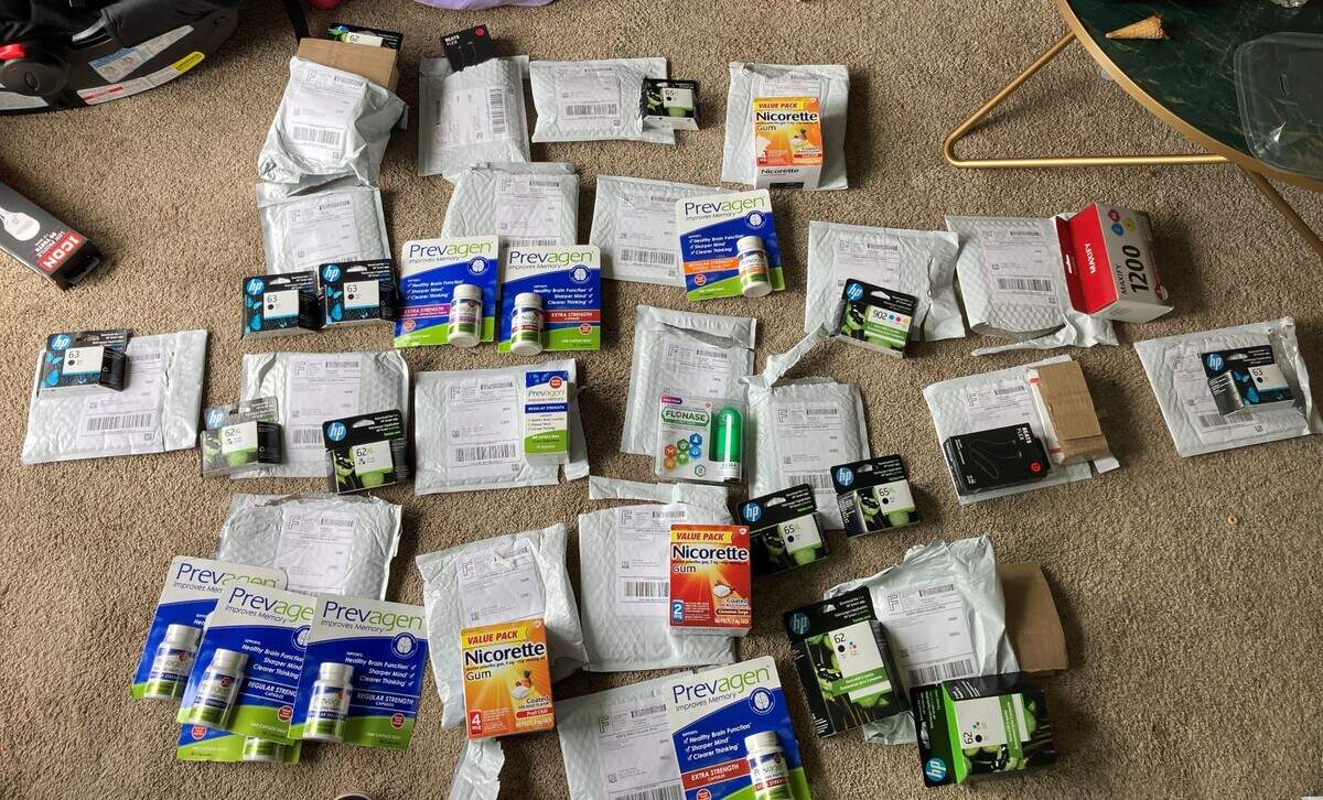 Stolen counter medication and priner ink cartridges are displayed inside a Federal Way home on June 20, 2023.