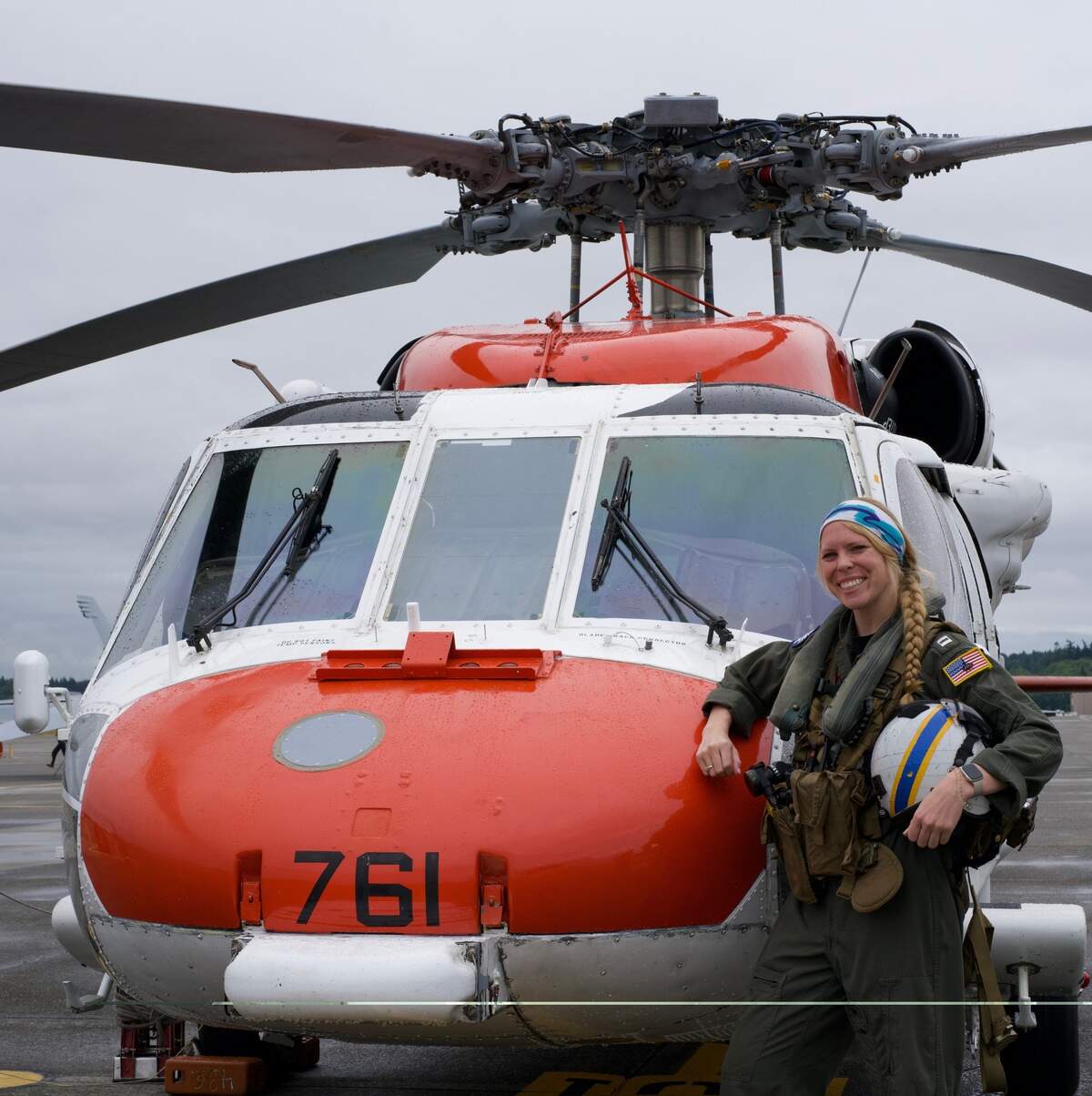 Lt. Victoria Weckenbrock posing in front of a Navy MH-60S “Sierra” Knighthawk.