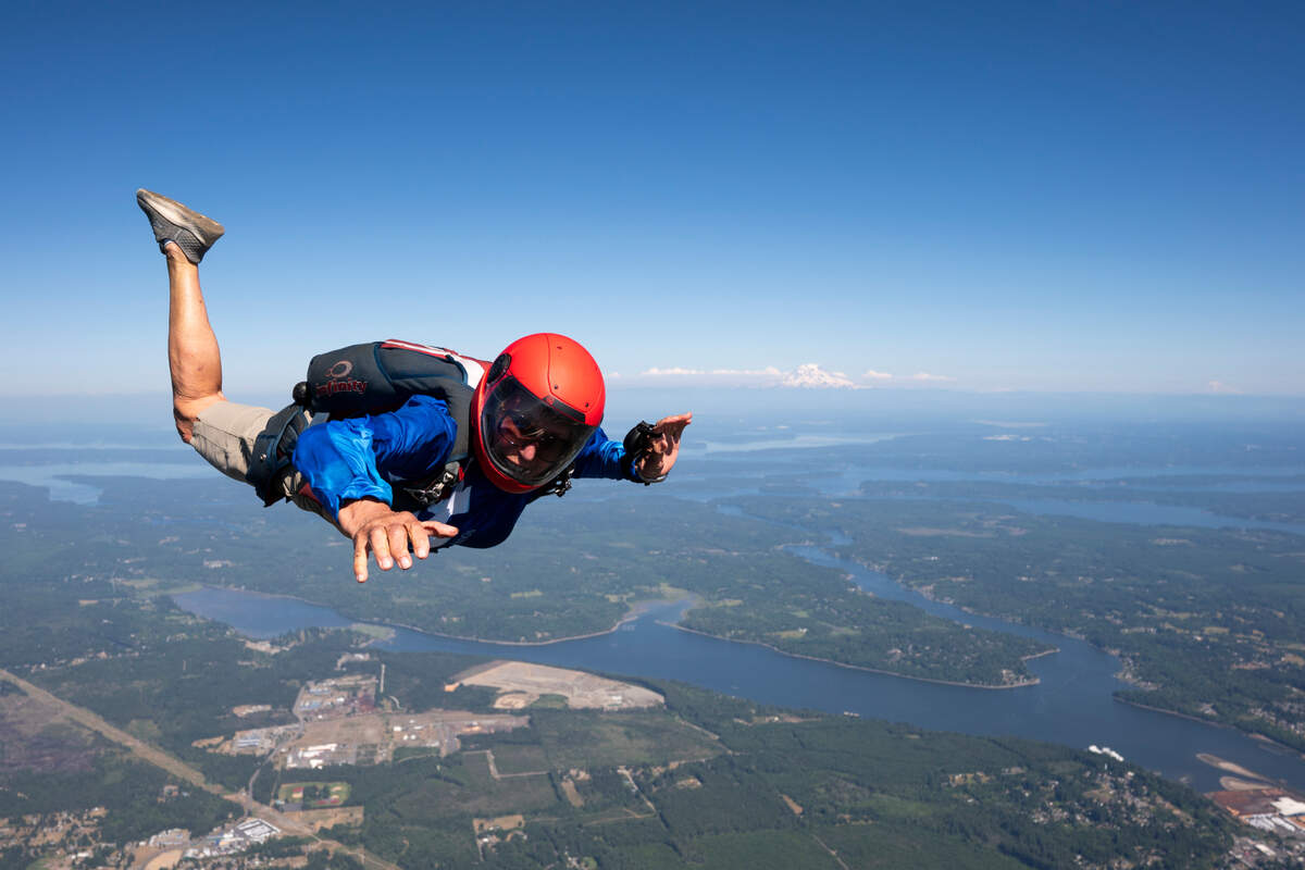 Jessie Farrington skydives above Skydive Kapowsin, on Monday, June 9, 2025, in Shelton, Wash. The 75 year old has been parachuting since she was 15 years old.
