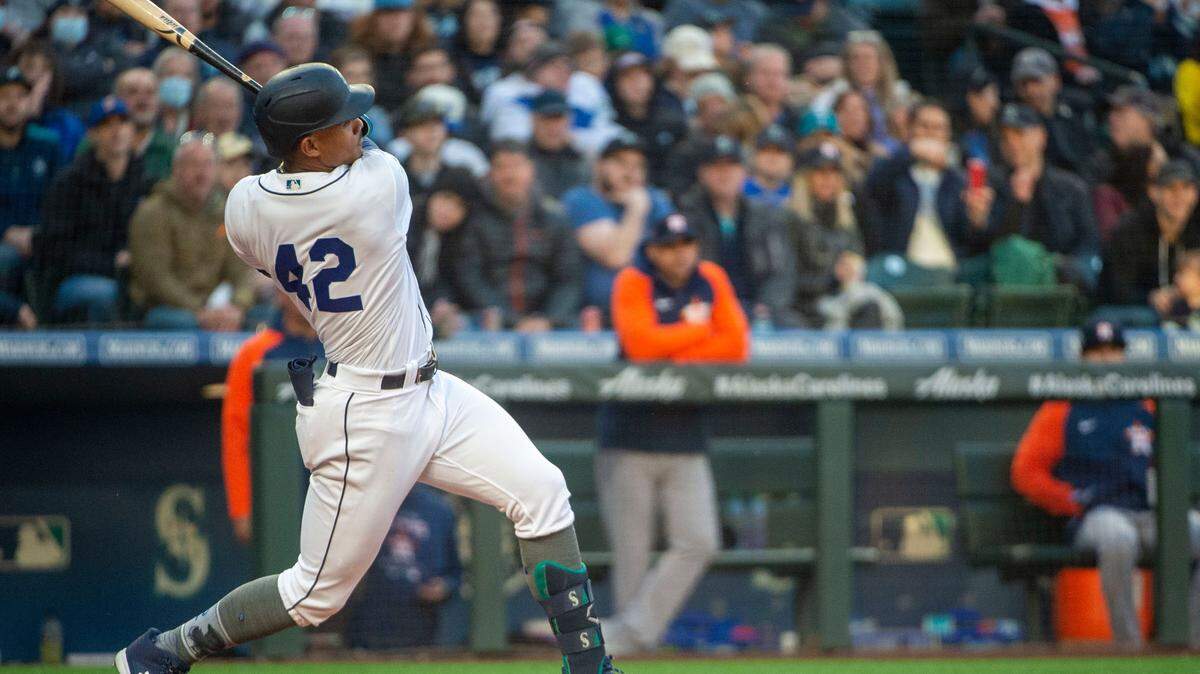 Seattle Mariners center fielder Julio Rodriguez (44) singles to left field in the bottom of the second inning of the home opener at T-Mobile Park in Seattle on Friday, April 15, 2022.