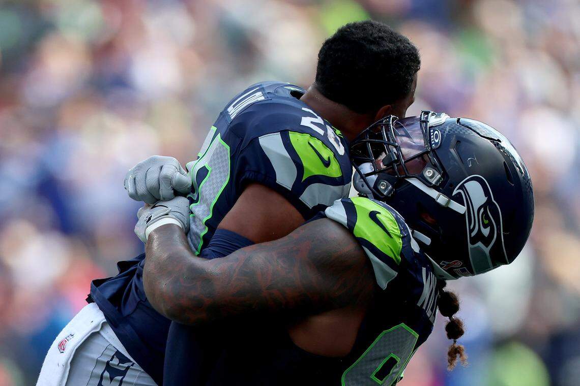SEATTLE, WASHINGTON - SEPTEMBER 07: Julian Love #20 of the Seattle Seahawks and Leonard Williams #99 of the Seattle Seahawks celebrate against the San Francisco 49ers during the game at Lumen Field on September 07, 2025 in Seattle, Washington. (Photo by Amanda Loman/Getty Images)