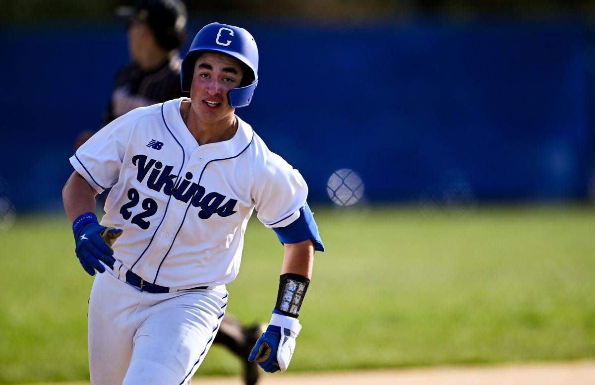 Curtis’s Harlan Carrillo (22) sprints for third base against Puyallup during the baseball game at Curtis Senior High School, on Tuesday, April 15, 2025, in University Place, Wash.