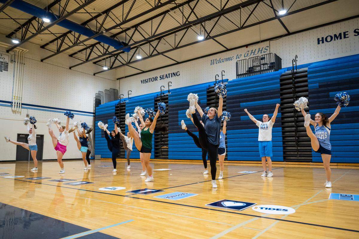 Gig Harbor High School Tides cheer team members practice their Band Dance Feb. 28, 2023 in the school's gymnasium. The dance was part of their record-breaking routine in the 3A Game Day Small division competition at the Washington Interscholastic Activities Association (WIAA) Cheerleading Tournament Central that they competed in on Feb. 4. 