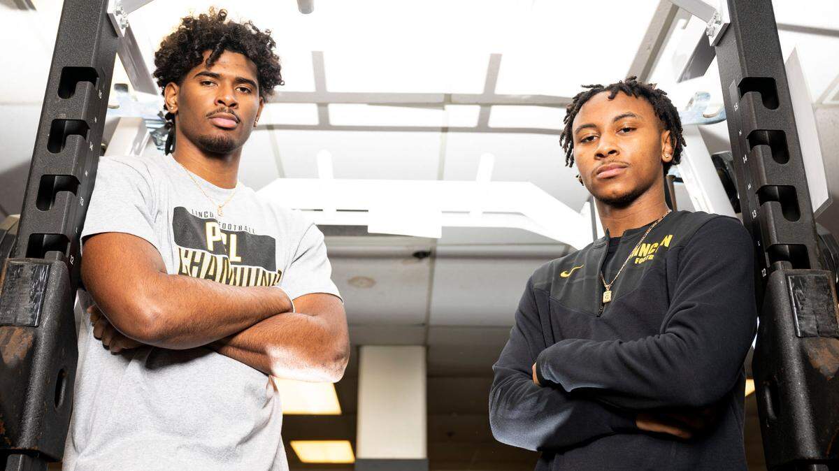 Lincoln High School juniors Jayden Wayne (left) and Gabarri Johnson pose for a portrait in the high school’s weight room on Friday, Jan. 28, 2022, in Tacoma, Wash.