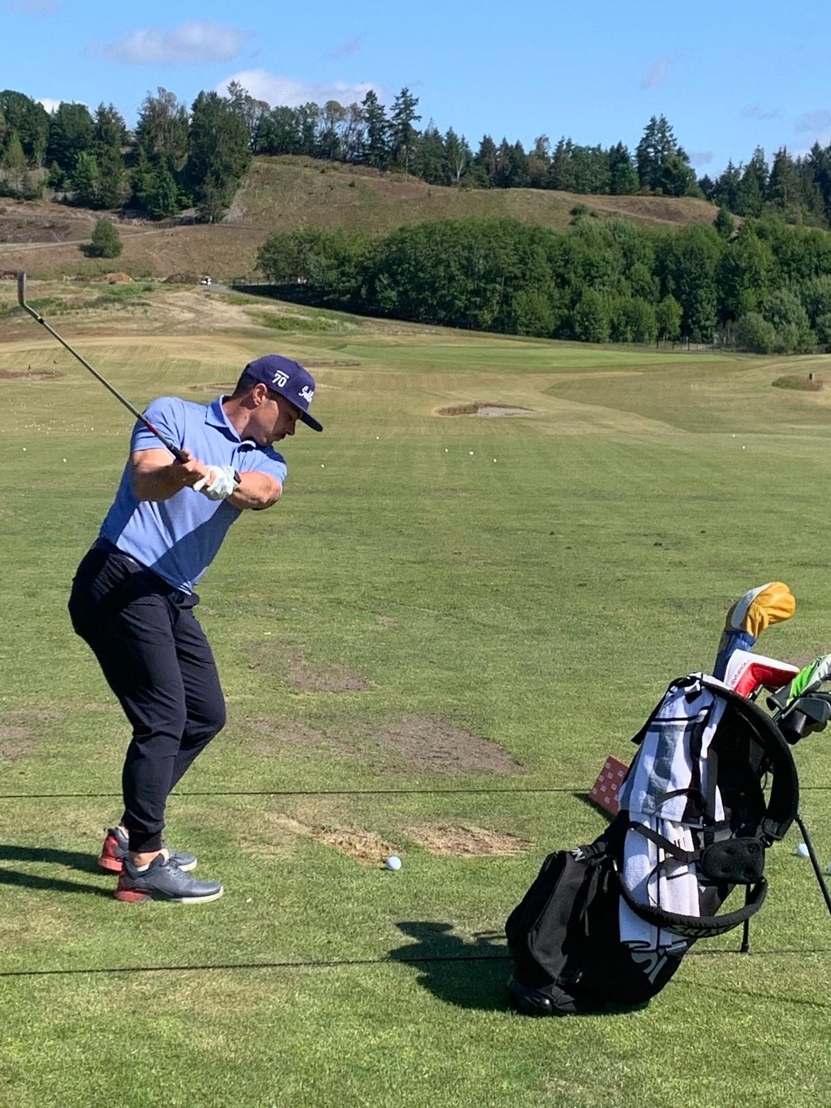 Former NFL running back Danny Woodhead on the practice range at Chambers Bay before he started the U.S. Amateur Four-Ball Championship Saturday, May 22.