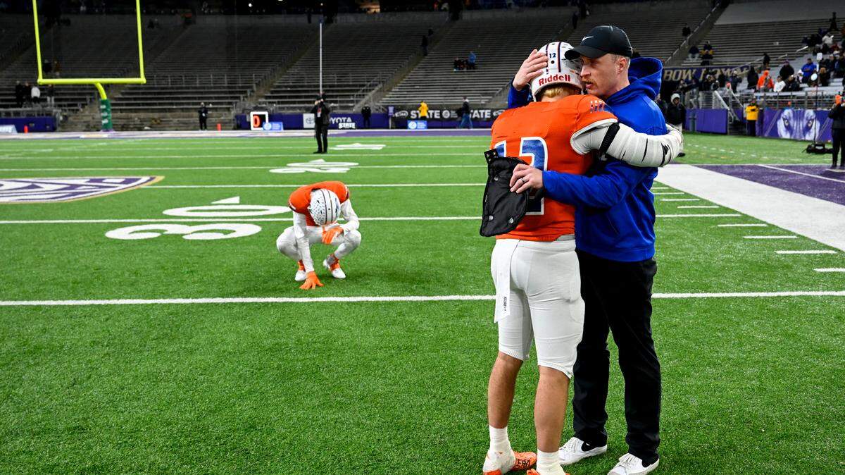 Graham-Kapowsin players react to their 31-6 loss to Lake Stevens in the 4A state championship game at Husky Field, Saturday, Dec. 2, 2023, in Seattle, Wash.