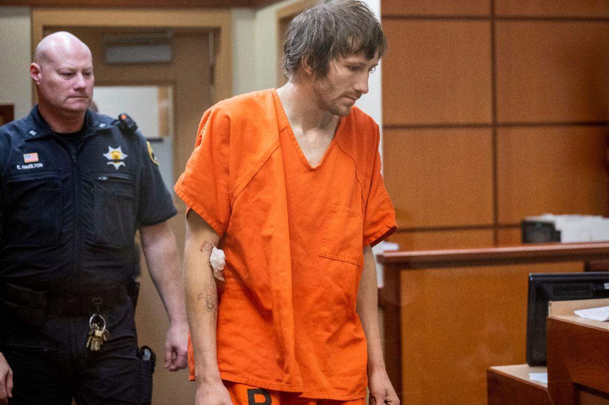 Paul Michael Harrison Snider, 28, makes his initial appearance in Pierce County Superior Court on Wednesday, Nov. 23, 2022, in Tacoma, Wash. Snider is accused of shooting two people to death early Monday, Nov. 21, 2022, in Tacoma. He also allegedly admitted to being present at another fatal shooting earlier this year. Pierce County Superior Court Commissioner Philip Thornton set his bail at $5 million.