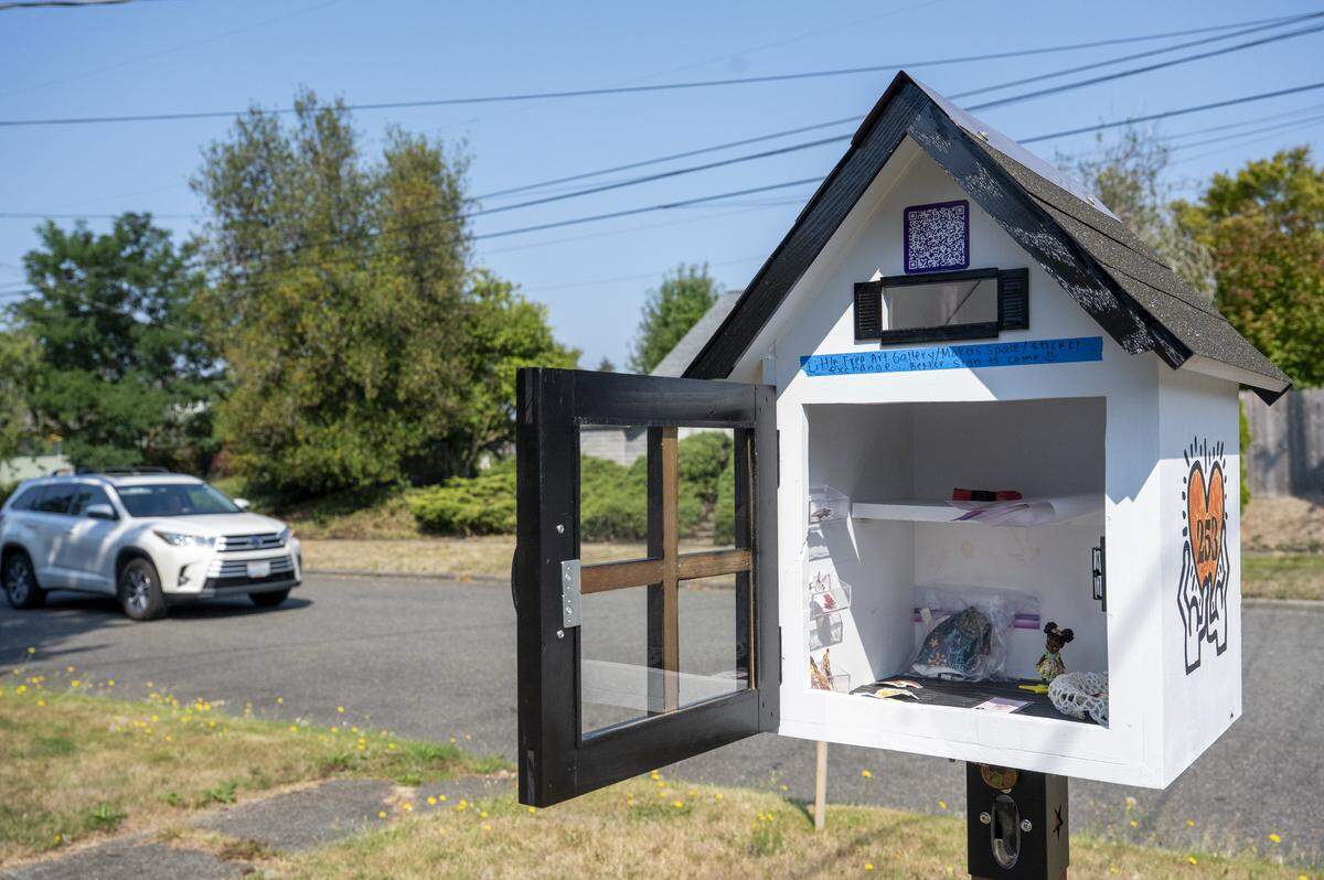 The Grit City Sticker House, a Free Little Art Gallery, welcomes people to leave or take art inside on Thursday, Aug. 28, 2025, along North 11th Street in Tacoma.