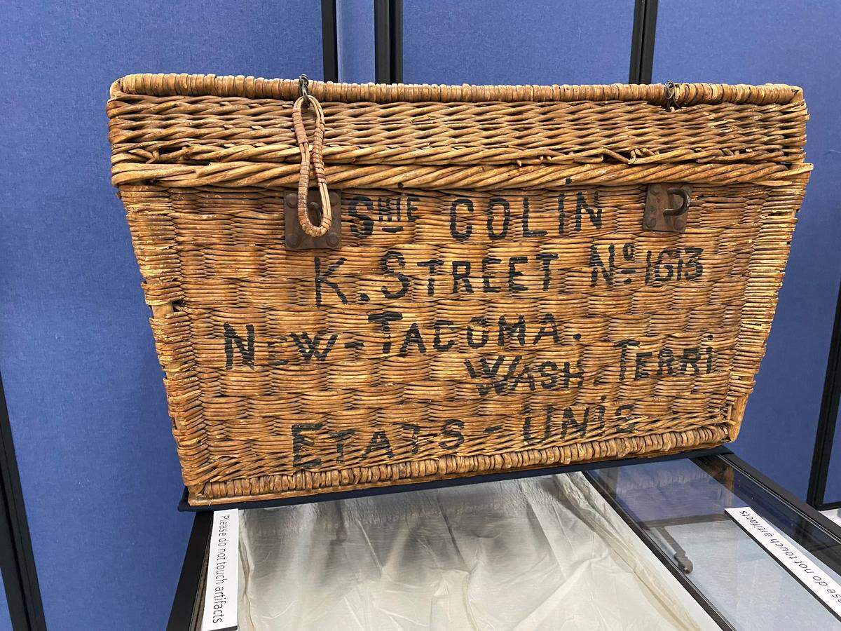 A wicker travel case that belonged to Sophie Collin, a 29 year old Swiss immigrant who arrived in Tacoma in 1889, is on display at the Tacoma Historical Society exhibit.
