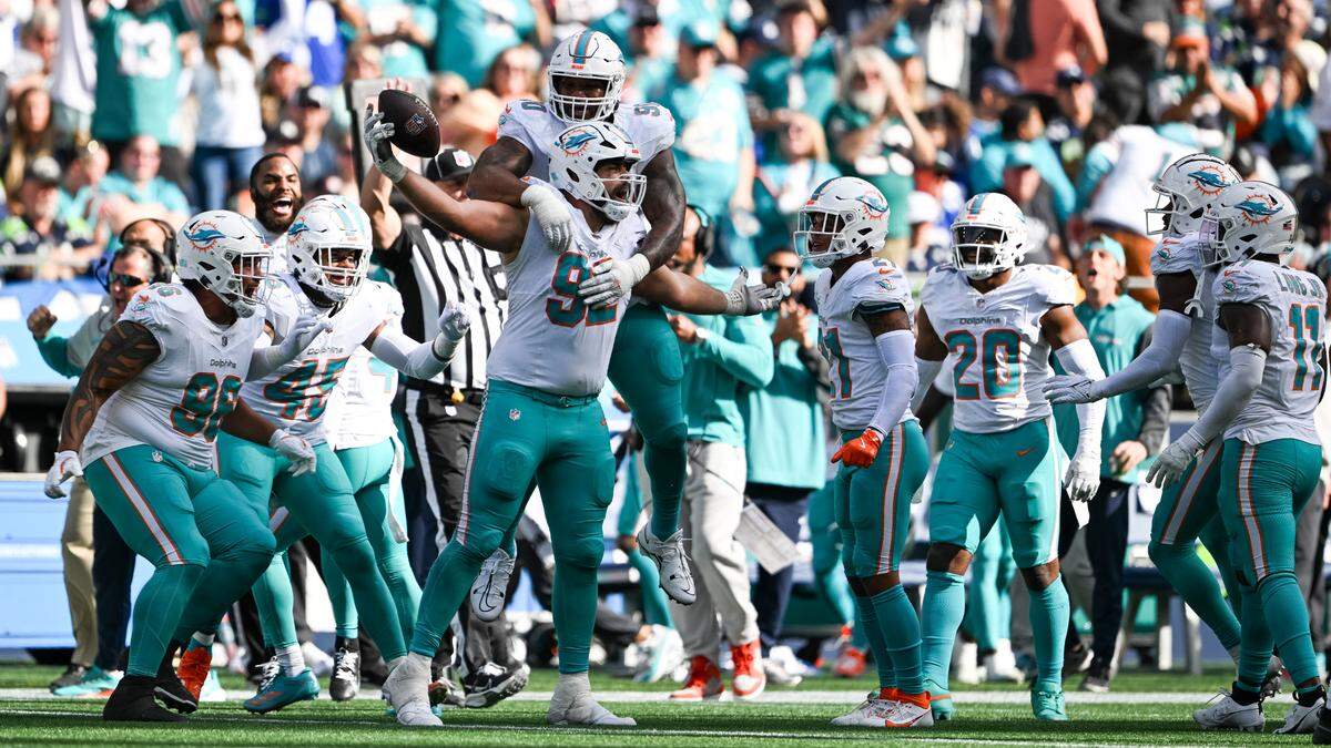 Miami Dolphins defensive tackle Zach Sieler (92) reacts to an interception of a pass thrown by Seattle Seahawks quarterback Geno Smith (7) during the third quarter of the game at Lumen Field, on Sunday, Sept. 22, 2024, in Seattle, Wash.