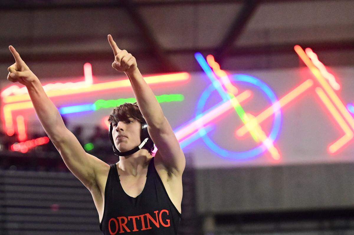 Orting’s Dalton Reed celebrates after pinning Prosser’s Nehemiah Michael Medrano in the 182-pound 2A championship match at Mat Classic XXXIII on Saturday, Feb. 19, 2022, at the Tacoma Dome in Tacoma, Wash. Reed pinned Medrano in 45 seconds.