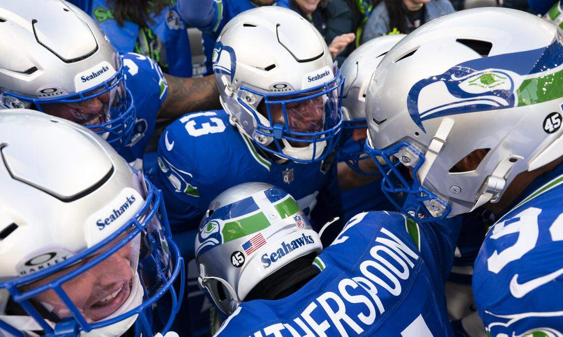 Seattle Seahawks linebacker Ernest Jones IV (13) celebrates his 85-yard interception returned for a touchdown during the second quarter of the game against the Minnesota Vikings at Lumen Field, on Sunday, Nov. 30, 2025, in Seattle.