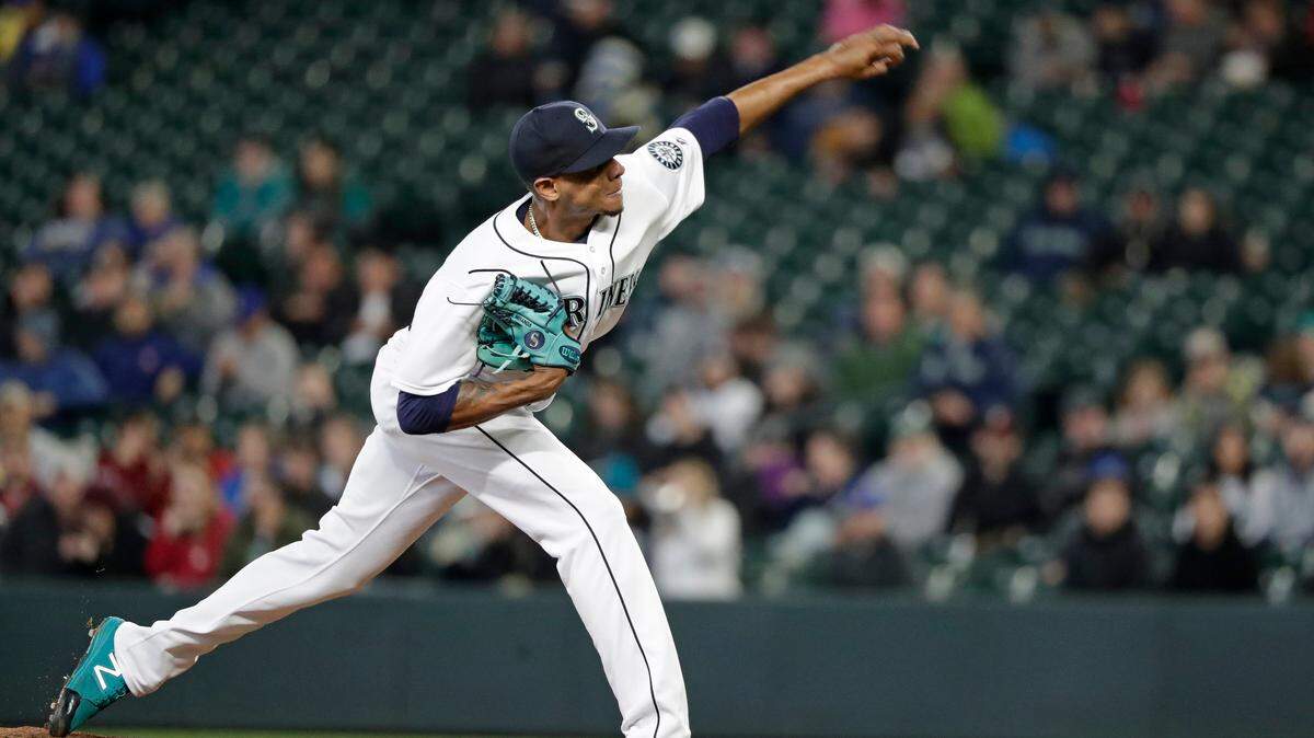 Seattle Mariners starting pitcher Ariel Miranda throws against the Houston Astros in the first inning of a baseball game Tuesday, April 17, 2018, in Seattle. (AP Photo/Elaine Thompson)