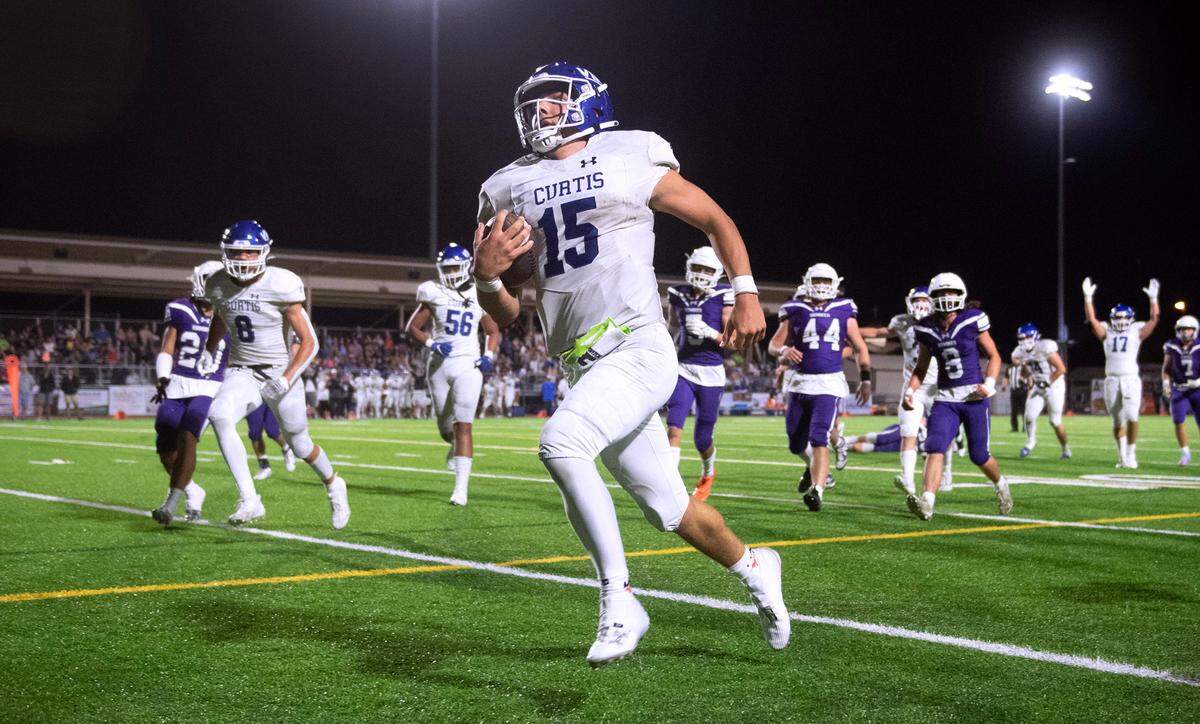 Curtis quarterback Rocco Koch sprints for a touchdown during Friday night’s football game against the Sumner Spartans at Sunset Chevy Stadium in Sumner, Washington, on Sept. 8, 2023. Curtis won the game, 38-33.