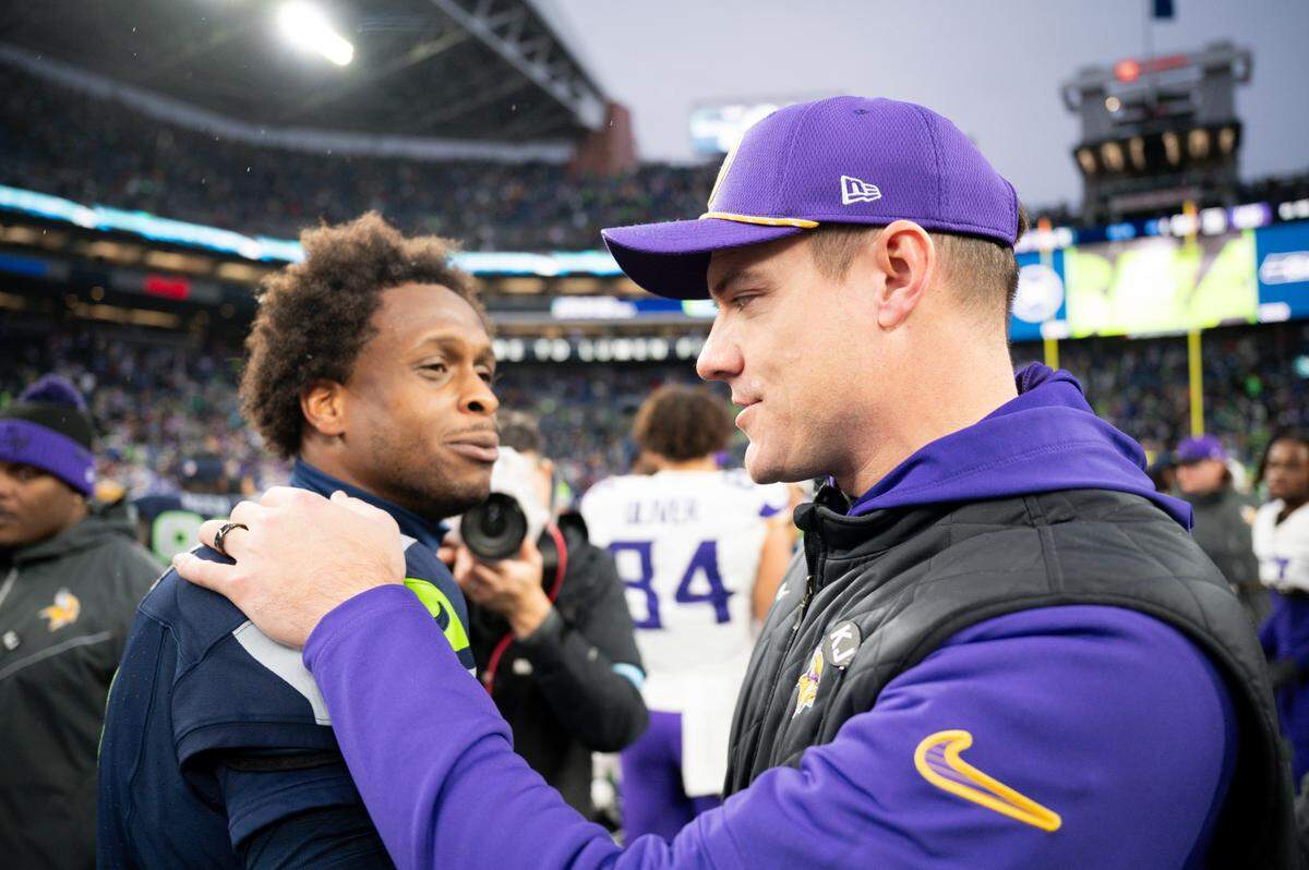 Seattle Seahawks quarterback Geno Smith (7) and Minnesota Vikings head coach Kevin O’Connell chat after the Vikings 27-24 victory over Seattle Seahawks at Lumen Field, on Sunday, Dec. 22, 2024, in Seattle, Wash.