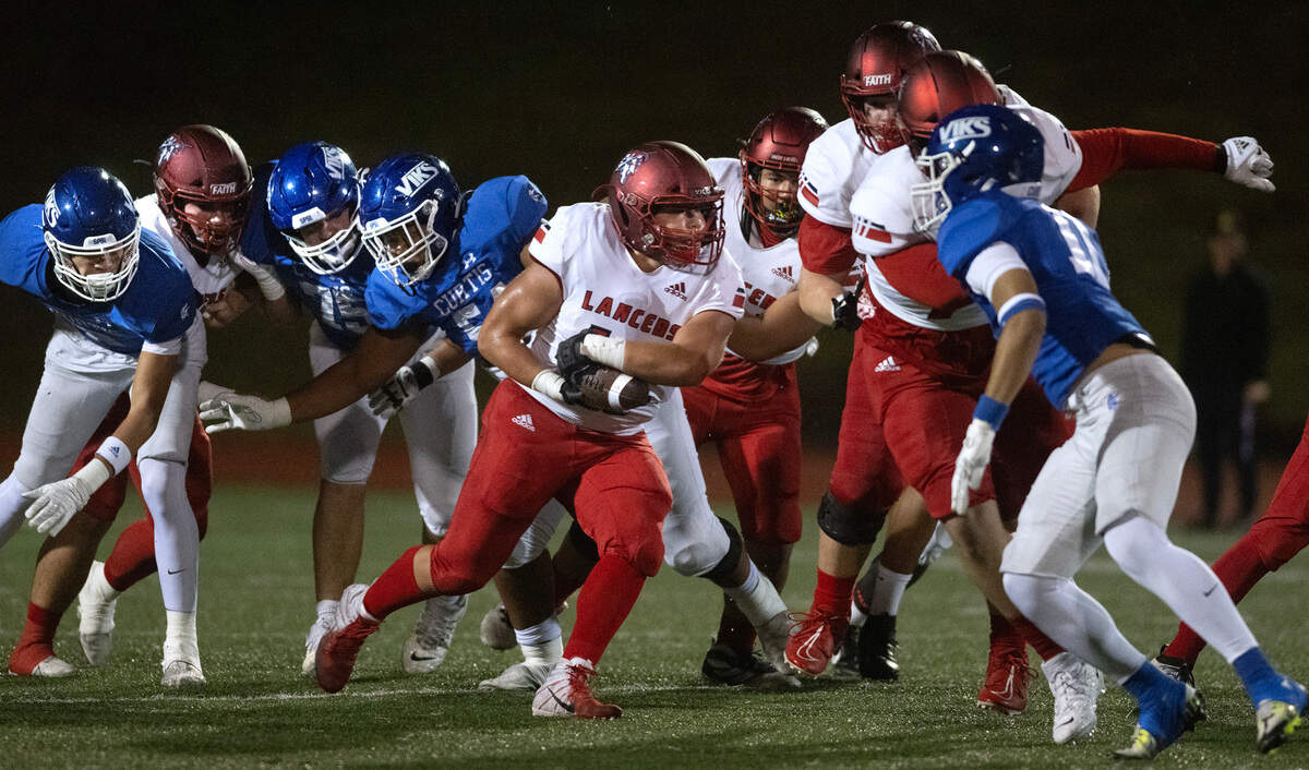 Kennedy Catholic running back Nikko Lecksiwilai runs up the middle during Friday night’s 4A state football opening round game against the Curtis Vikings at Viking Stadium in University Place on Nov. 10, 2023. Kennedy Catholic won the game, 37-34.