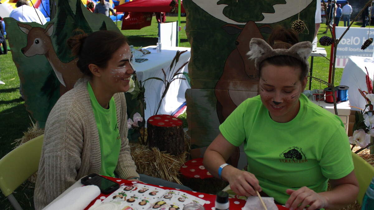 Guests and volunteers enjoy face painting at the 2017 Gig Harbor Cider Swig. This year’s event will be Saturday (Sept. 29).