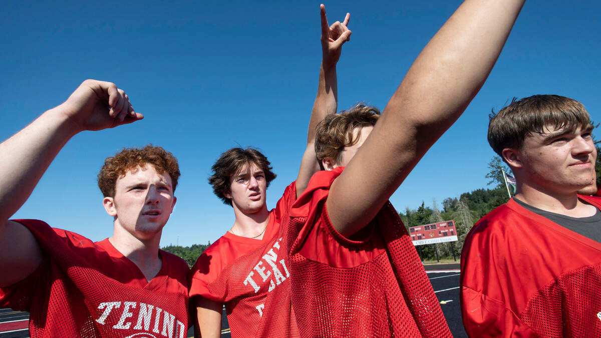 Tenino senior running backs Randall Marti (left) and Dylan Spicer rally the Beavers during football practice at Tenino Beaver Stadium in Tenino, Washington on Thursday, Aug. 25, 2022.