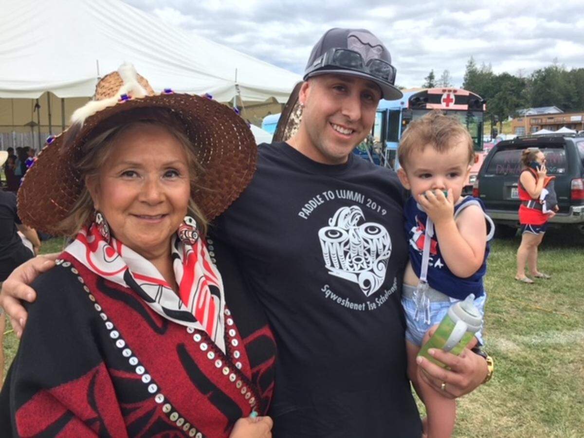 Raynell Morris, an enrolled Lummi Tribal member, with her son Kyle and grandson. Morris describes herself as devoted to her grandchildren, who call her “Grandma Sparkles.”