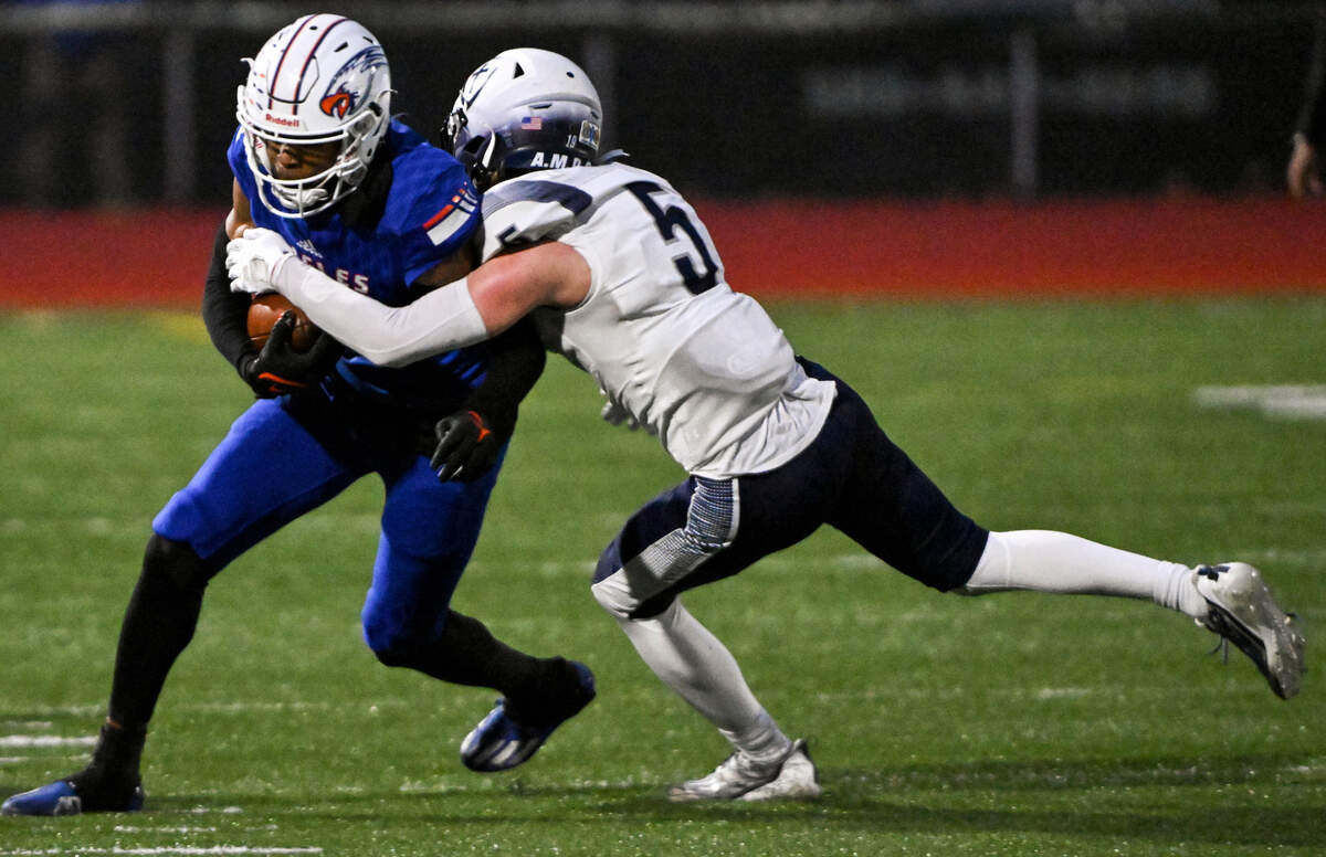 Graham-Kapowsin’s Malachi Durant (1) is knocked out of bound by Gonzaga Prep’s Jackson Pierce (5) after the catch during the second half of the 4A quarterfinal state championship game at Art Crate Field, Saturday, Nov. 18, 2023, in Spanaway, Wash.