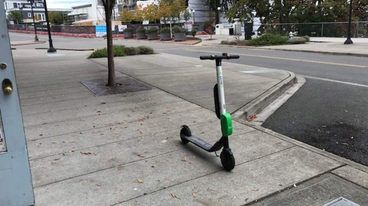 A Lime scooter parked Friday afternoon on the sidewalk along Broadway near McMenamins Elks Lodge in Tacoma.