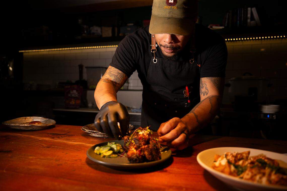 The St. Louis-style, masala-spiced tandoori ribs are smoked then grilled to order. Howell finishes the plate with achar cucumbers and house coco bread.