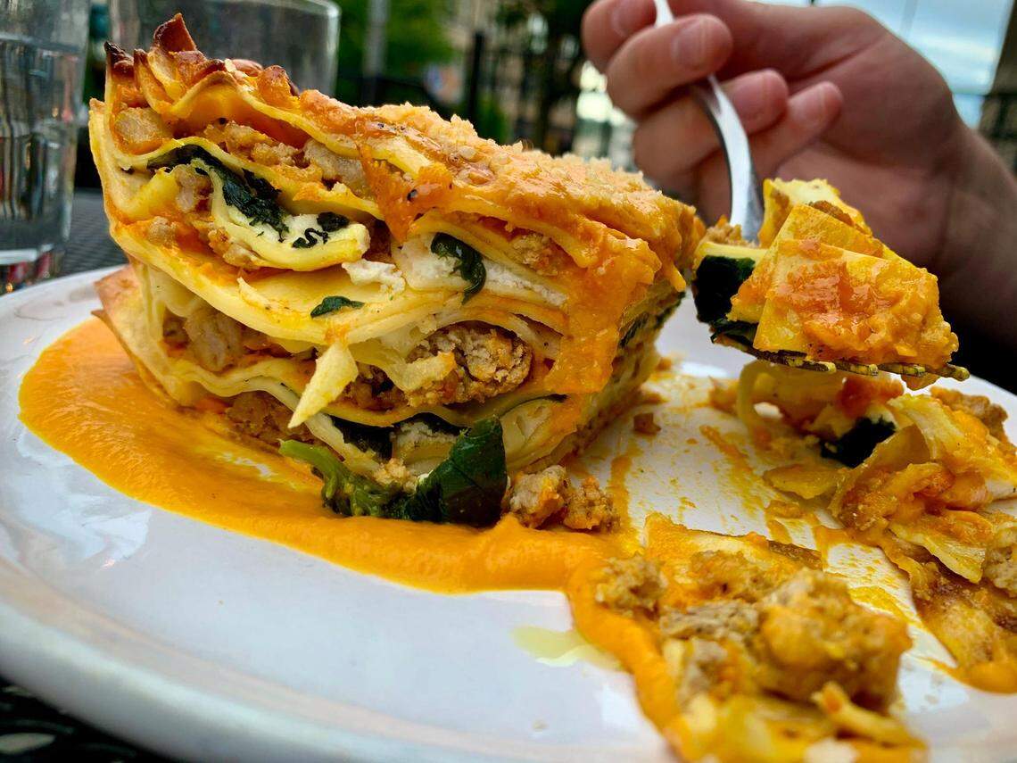 Italian and Spanish influenced fare, like this carrot lasagna with housemade noodles and sausage, shines at en rama in downtown Tacoma, Wash., at Courthouse Square.