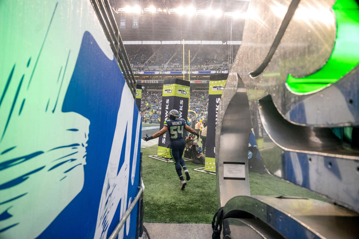 Seattle Seahawks middle linebacker Bobby Wagner (54) is introduced prior to the start of an NFL game against against the Detroit Lions on Sunday, Jan. 2, 2022, at Lumen Field in Seattle.