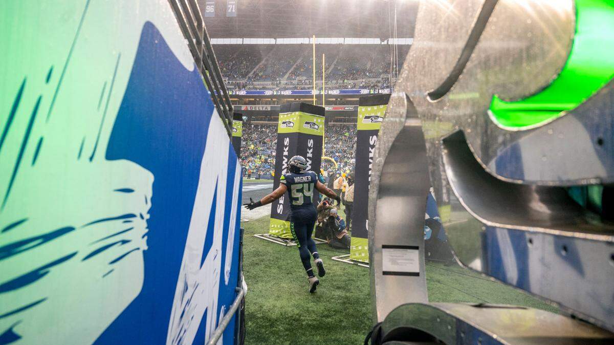 Seattle Seahawks middle linebacker Bobby Wagner (54) is introduced prior to the start of an NFL game against against the Detroit Lions on Sunday, Jan. 2, 2022, at Lumen Field in Seattle.