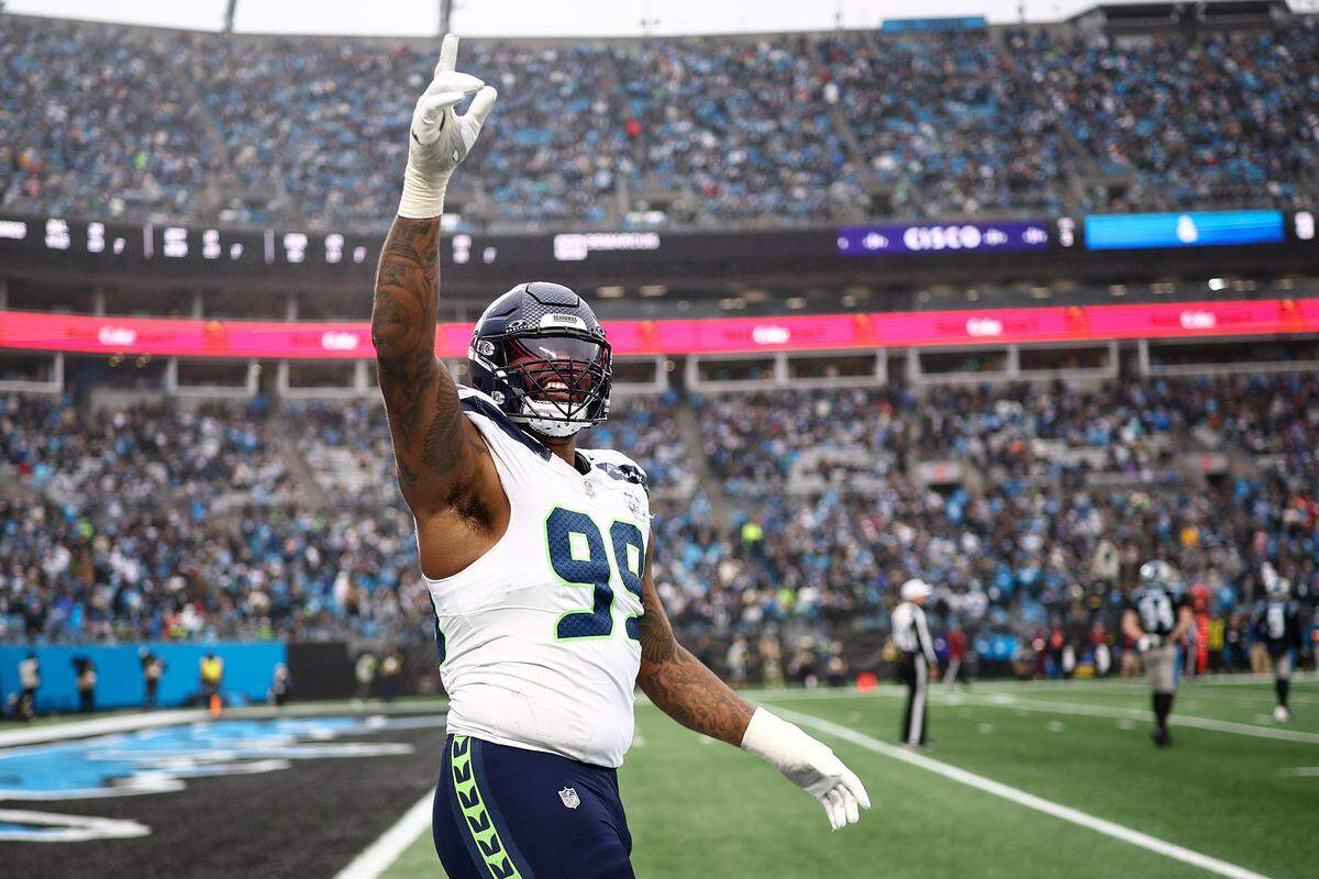 CHARLOTTE, NORTH CAROLINA - DECEMBER 28: Leonard Williams #99 of the Seattle Seahawks reacts after a fumble from the Carolina Panthers during the second half at Bank of America Stadium on December 28, 2025 in Charlotte, North Carolina. (Photo by Jared C. Tilton/Getty Images)
