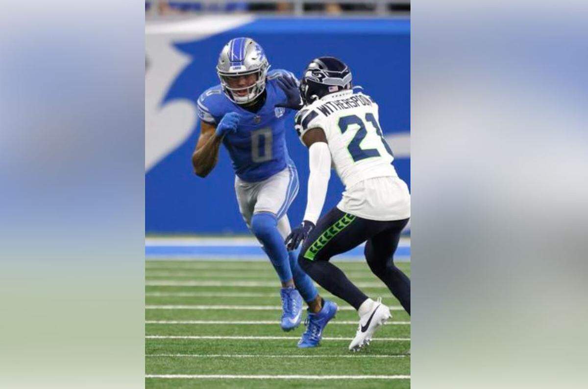 Detroit Lions wide receiver Marvin Jones Jr. (0) breaks from the line against Seattle Seahawks cornerback Devon Witherspoon (21) during the first half Sunday, Sept. 17, 2023, in Detroit. It was Witherspoon’s first NFL game.