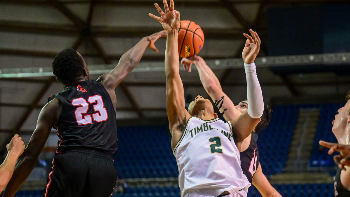 Timberline guard Miles Gurske (2) has his shot blocked by Mountlake Terrace guard Jeffrey Anyimah (23) during the fourth quarter of a Class 3A state tournament game on Wednesday, March 2, 2022, at the Tacoma Dome, in Tacoma, Wash.