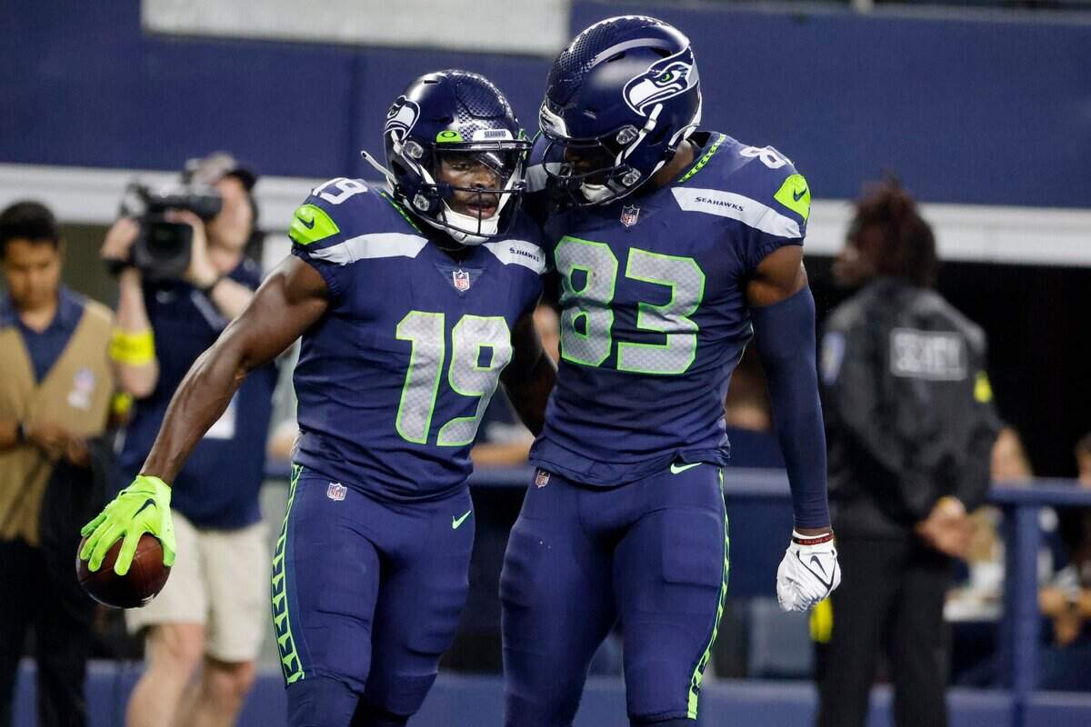 Seattle Seahawks wide receiver Penny Hart (19) and wide receiver Dareke Young (83) celebrate Hart’s touchdown catch in the first half of a preseason NFL football game against the Dallas Cowboys in Arlington, Texas, Friday, Aug. 26, 2022. (AP Photo/Michael Ainsworth)