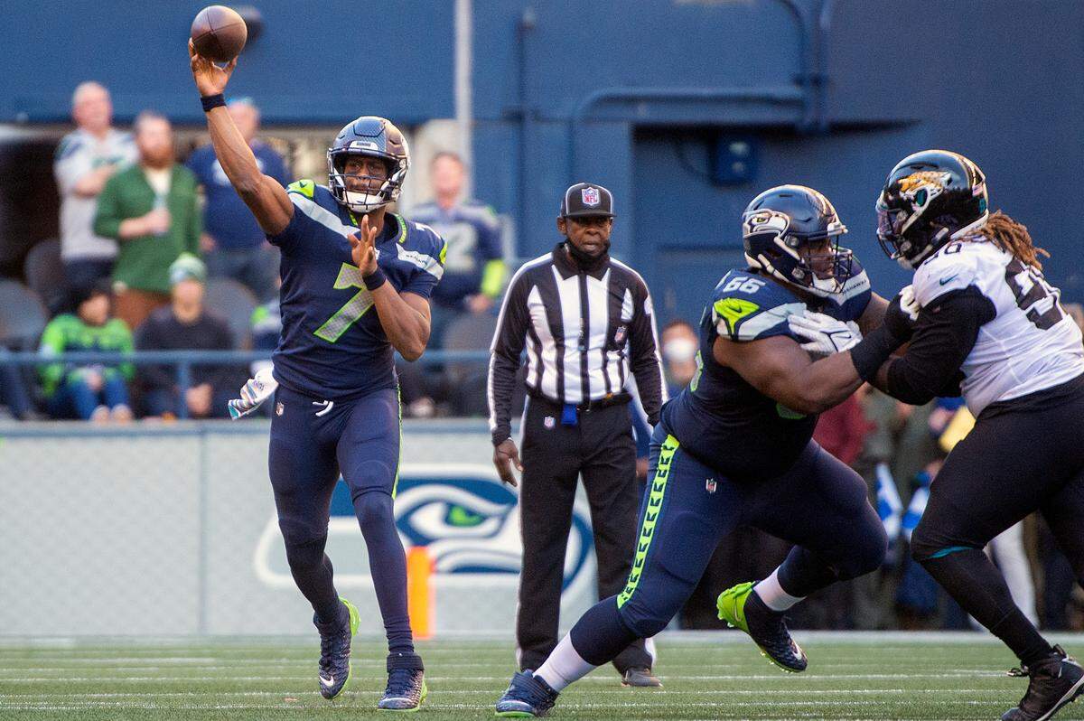 Seattle Seahawks quarterback Geno Smith (7) attempts a pass during the fourth quarter of an NFL game against the Jacksonville Jaguars on Sunday at Lumen Field in Seattle.