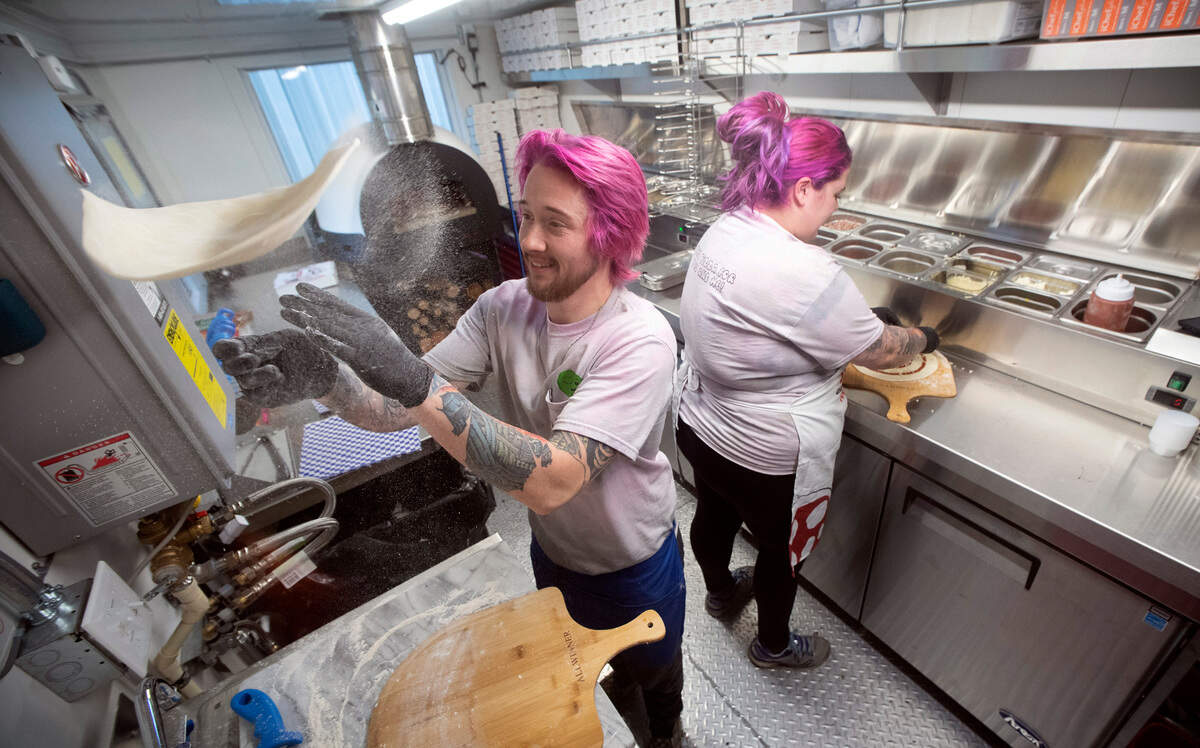 Samuel and Melissa Ranz at the grand opening of their “Just a Pizza My Mind” wood-fired pizza truck at Fierce County Cider in Puyallup, Washington, on Friday, Dec. 16, 2022.