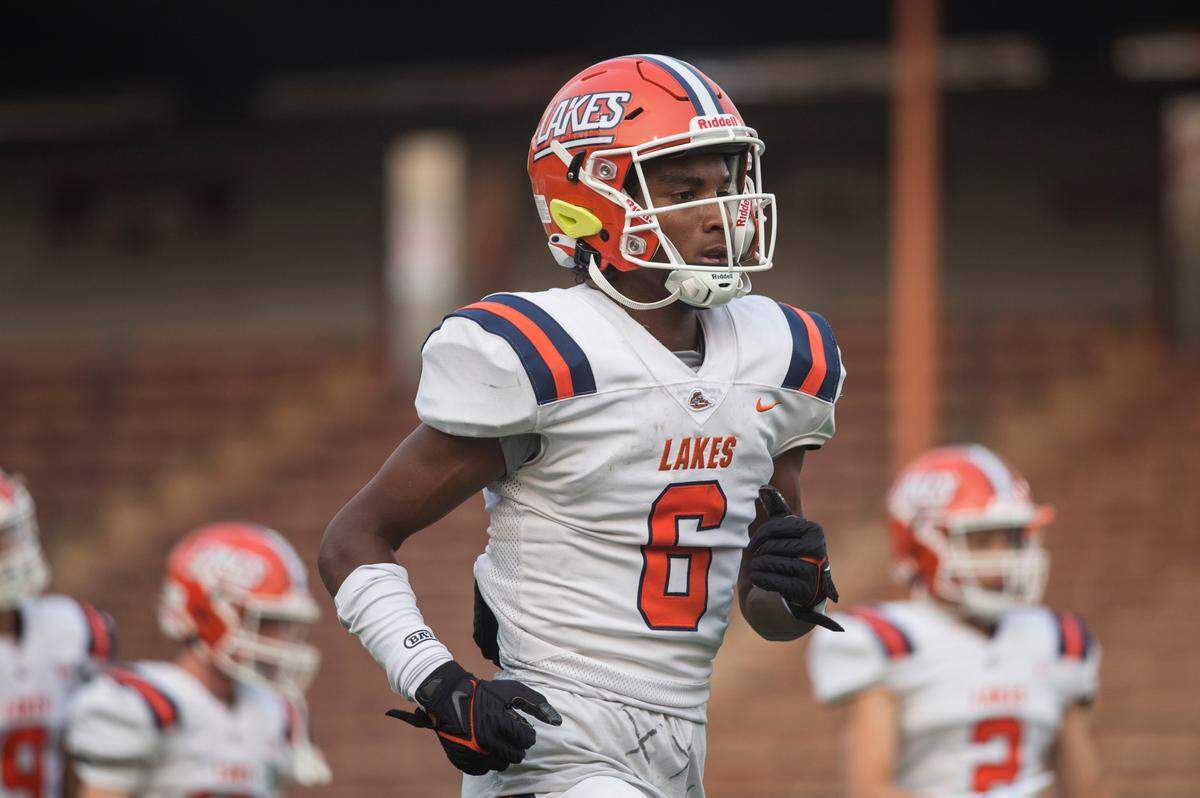 Lakes High School wide receiver and defensive back David Wells (6) warms up before a football game against Kentwood on Friday, Sept. 2, 2022 at French Field in Kent, Wash.