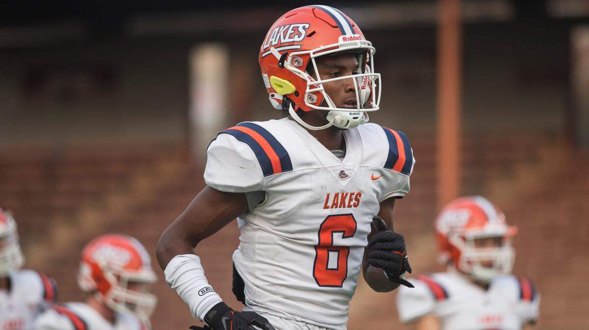 Lakes High School wide receiver and defensive back David Wells (6) warms up before a football game against Kentwood on Friday, Sept. 2, 2022 at French Field in Kent, Wash.