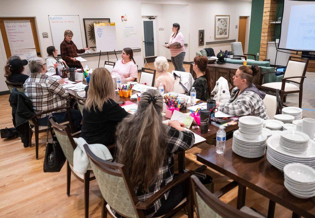 Staff members attend a training in preparation for the Mustard Seed Project, the first assisted living facility on the Key Peninsula, to open its doors soon in Lakebay, Wash. on Jan, 25, 2023.
