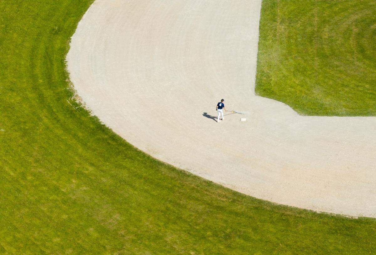 The Junior varsity baseball team cares for the baseball field at Gig Harbor High School, on Wednesday, April 30, 2025, in Gig Harbor, Wash.