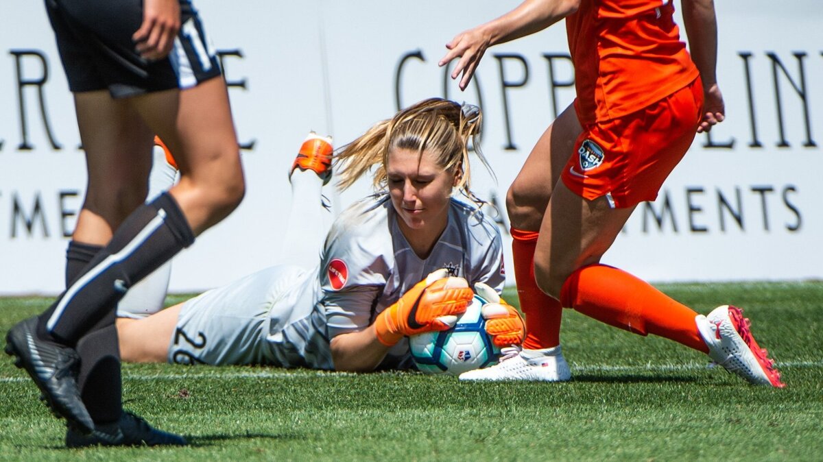 Reign FC’s Casey Murphy (26) makes a save in the second half. Reign FC played the Houston Dash in a NWSL soccer match at Cheney Stadium in Tacoma, Wash., on Sunday, June 2, 2019.