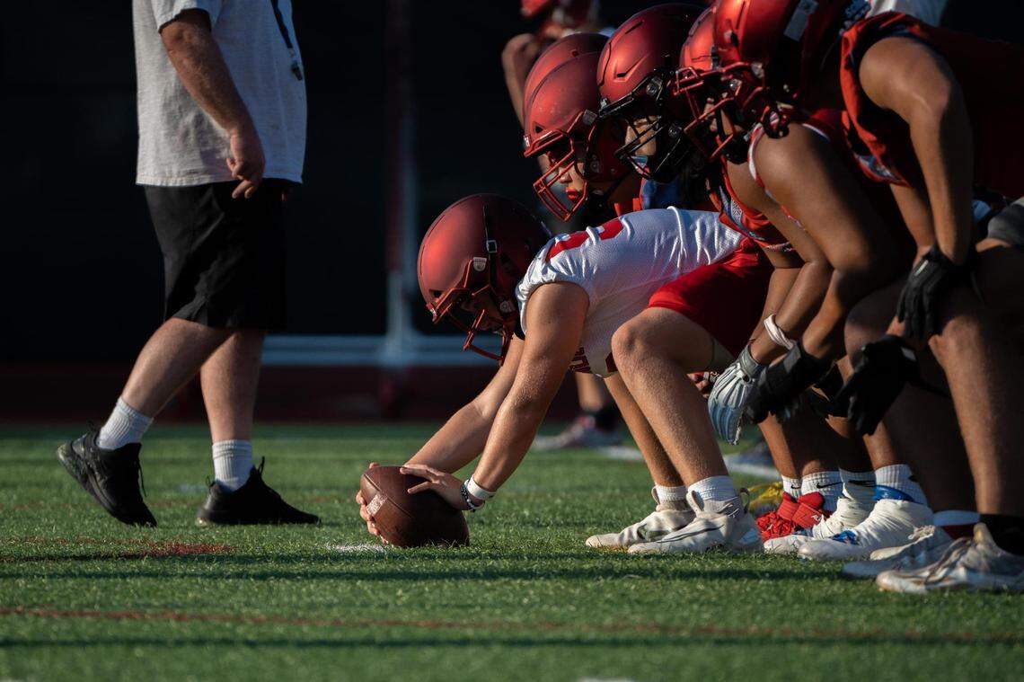 Kennedy Catholic High School football runs a scrimmage during practice at the high school in Burien, Wash. on Wednesday Aug. 17, 2022.