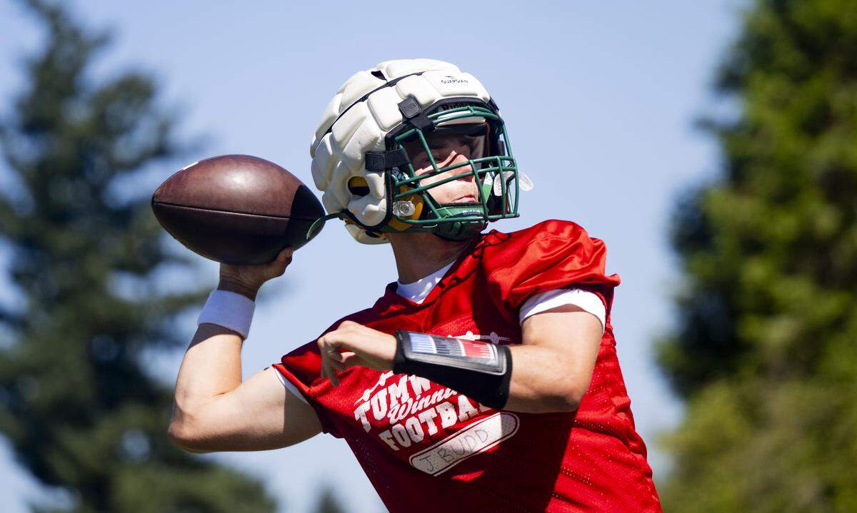Tumwater quarterback Jaxon Budd throws during a football practice at Tumwater High School on Friday, Aug. 22, 2025, in Tumwater, Wash.