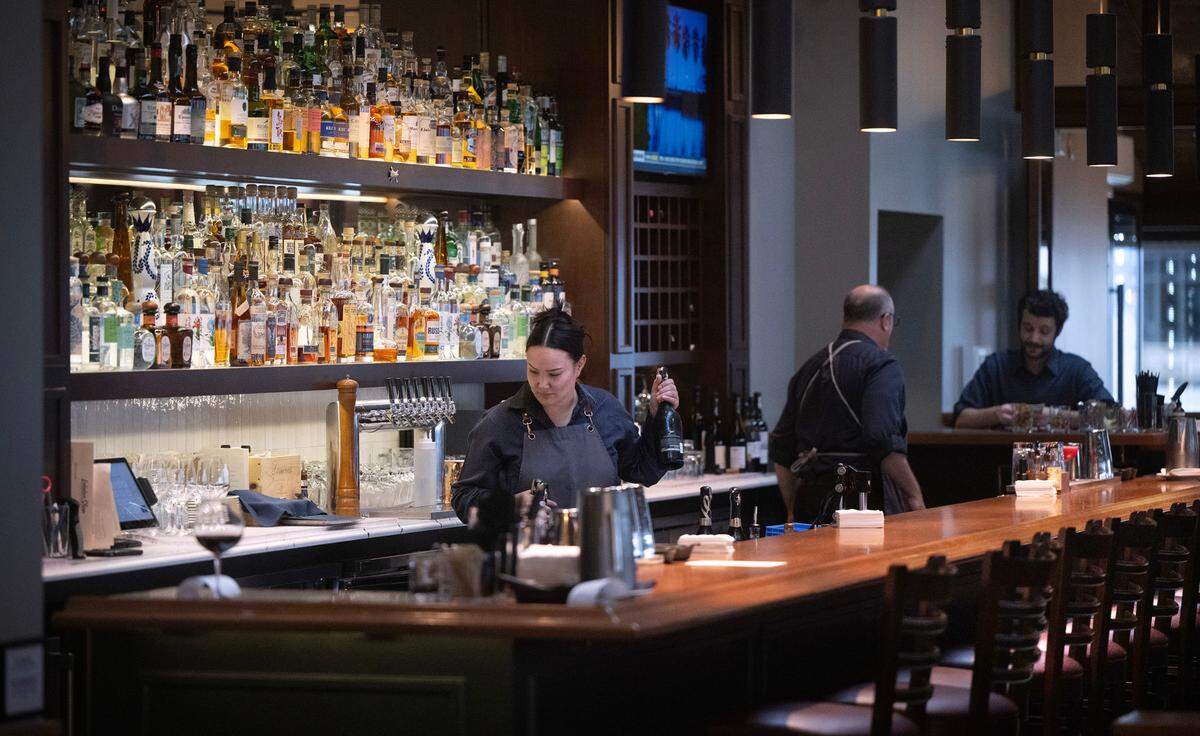 After a hefty renovation, E3 Restaurant Group reopened Lobster Shop in 2023 with a service charge intact. Despite giving up on the model in Tacoma, the company’s Seattle restaurants continue to use the charge to support a commision-based pay structure for their staff.