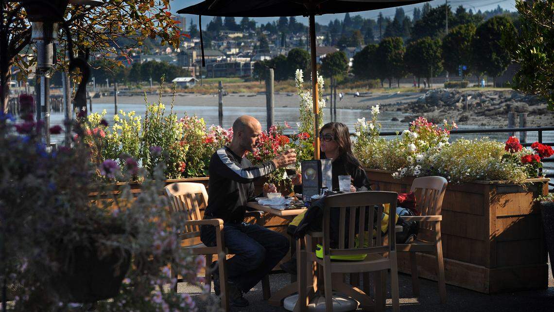 Diners enjoy the patio at Ram Restaurant & Brewery in Tacoma in 2012. The Puyallup Tribe has purchased the land and will lease The Ram back to the previous owner, who plans to continue the operation of the popular restaurant.
