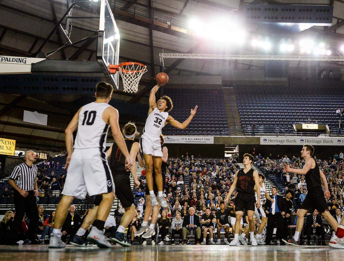 Gonzaga Prep’s Anton Watson (32) goes airborne for a dunk in the third quarter. Gonzaga Prep played Mount Si in the 4A boys championship game at the Hardwood Classic State Basketball Tournament at the Tacoma Dome in Tacoma, Wash., on Saturday, March 2, 2019.