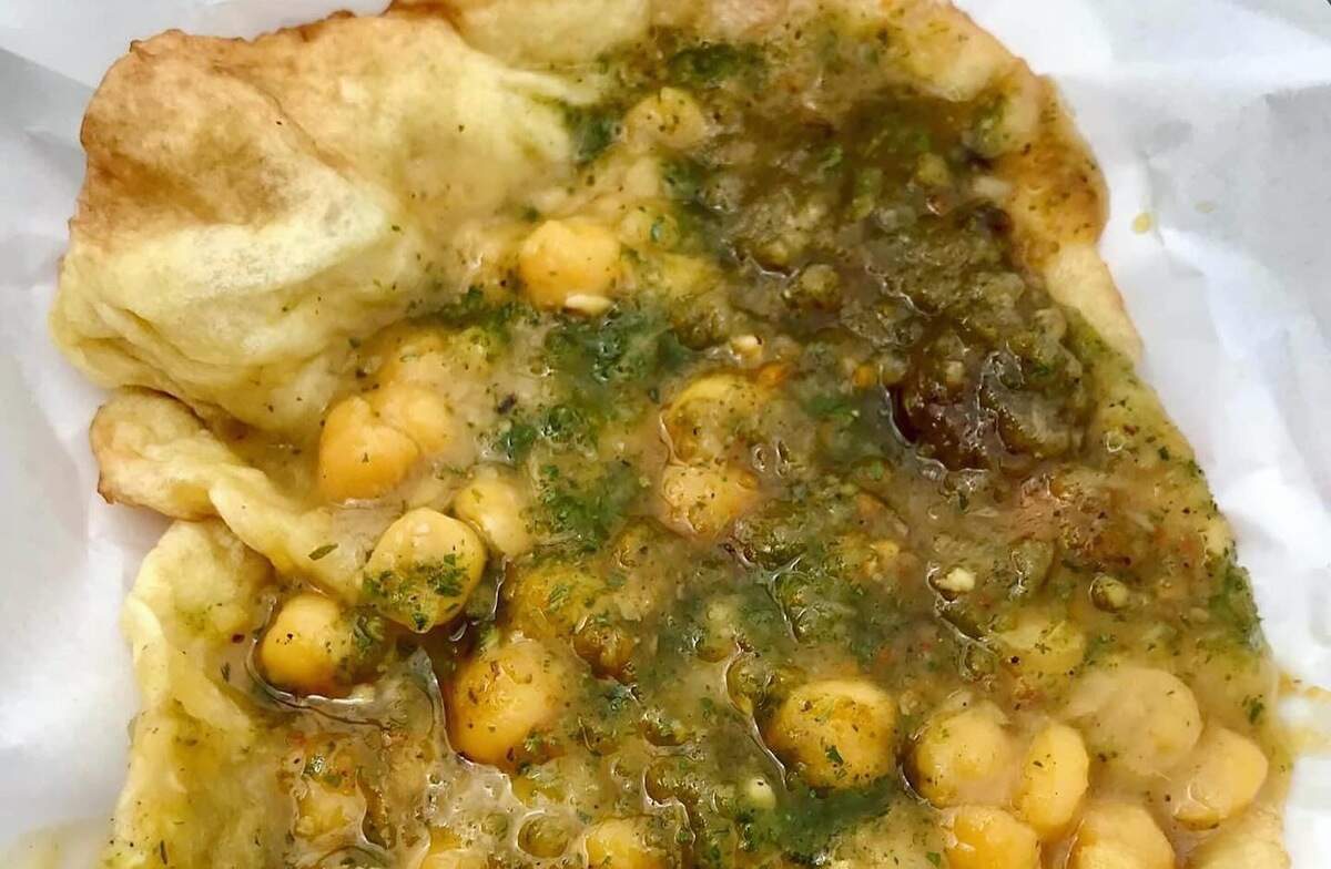 Trini Plate, based in Tacoma, honors the owner’s native home of Trinidad and Tobago. A staple of owner AbbyGail Wood’s menu is the famous street food known as Doubles, in which two fried flatbreads envelope curried chickpeas dressed in a tamarind-coriander sauce.