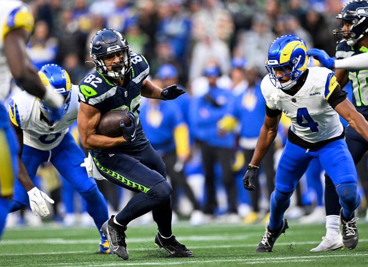 Seattle Seahawks wide receiver Cody White (82) picks up yards after the catch during the fourth quarter of the game against the Los Angeles Rams at Lumen Field, on Sunday, Nov. 3, 2024 in Seattle, Wash.