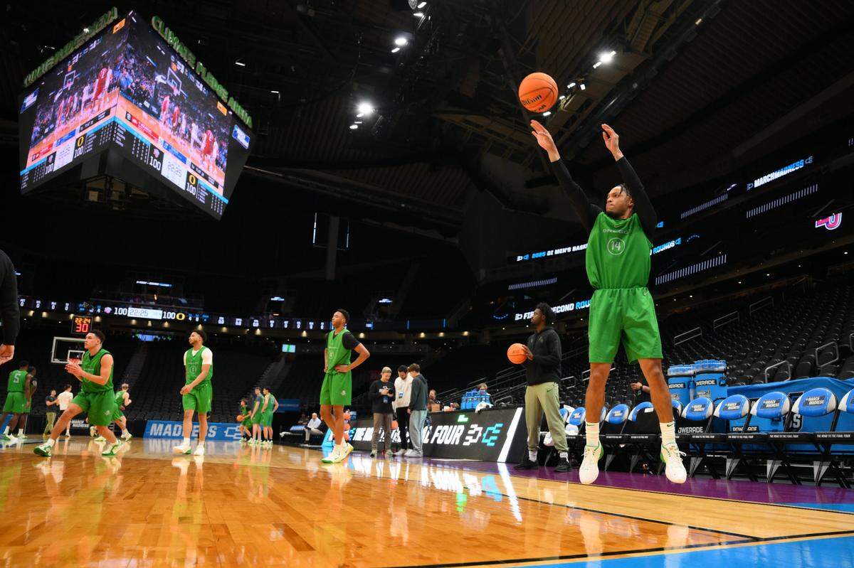 Mar 20, 2025; Seattle, WA, USA; Oregon Ducks guard Jayson Williams-Johnson (14) shoots the ball during practice at Climate Pledge Arena. Mandatory Credit: Steven Bisig-Imagn Images