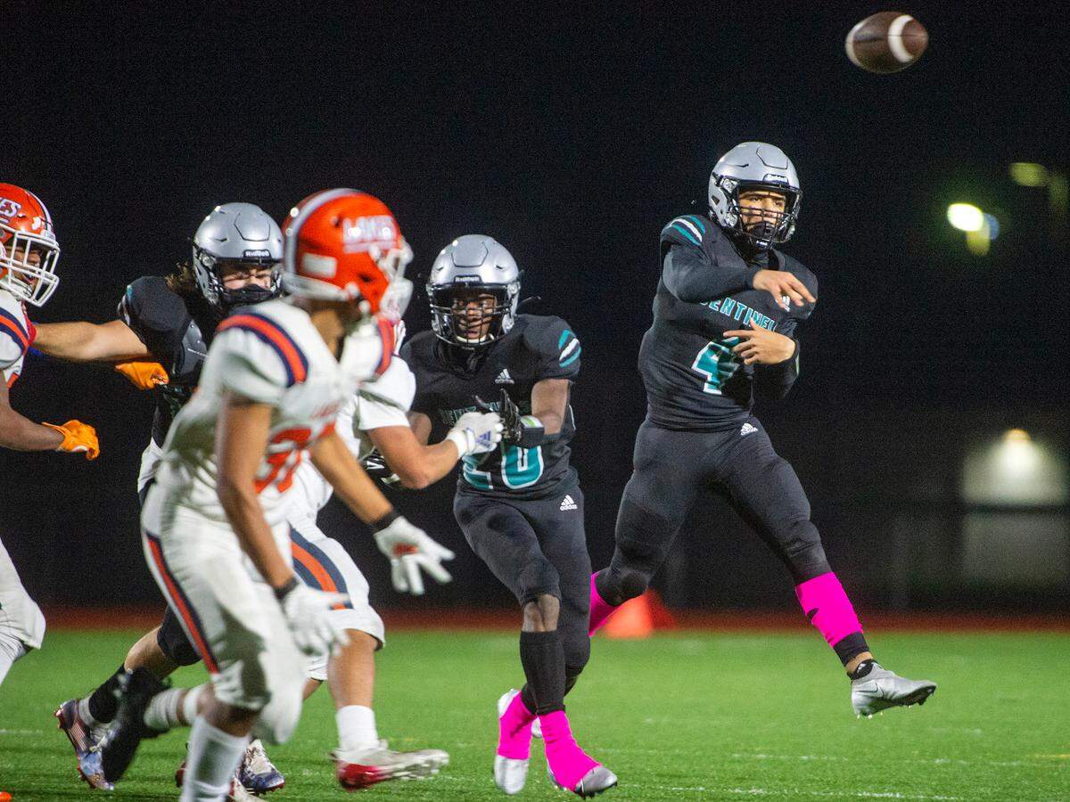 Spanaway Lake quarterback Dempsy James attempts a pass during the third quarter of a 3A Pierce County League game against Lakes on Friday at Art Crate Field in Spanaway.