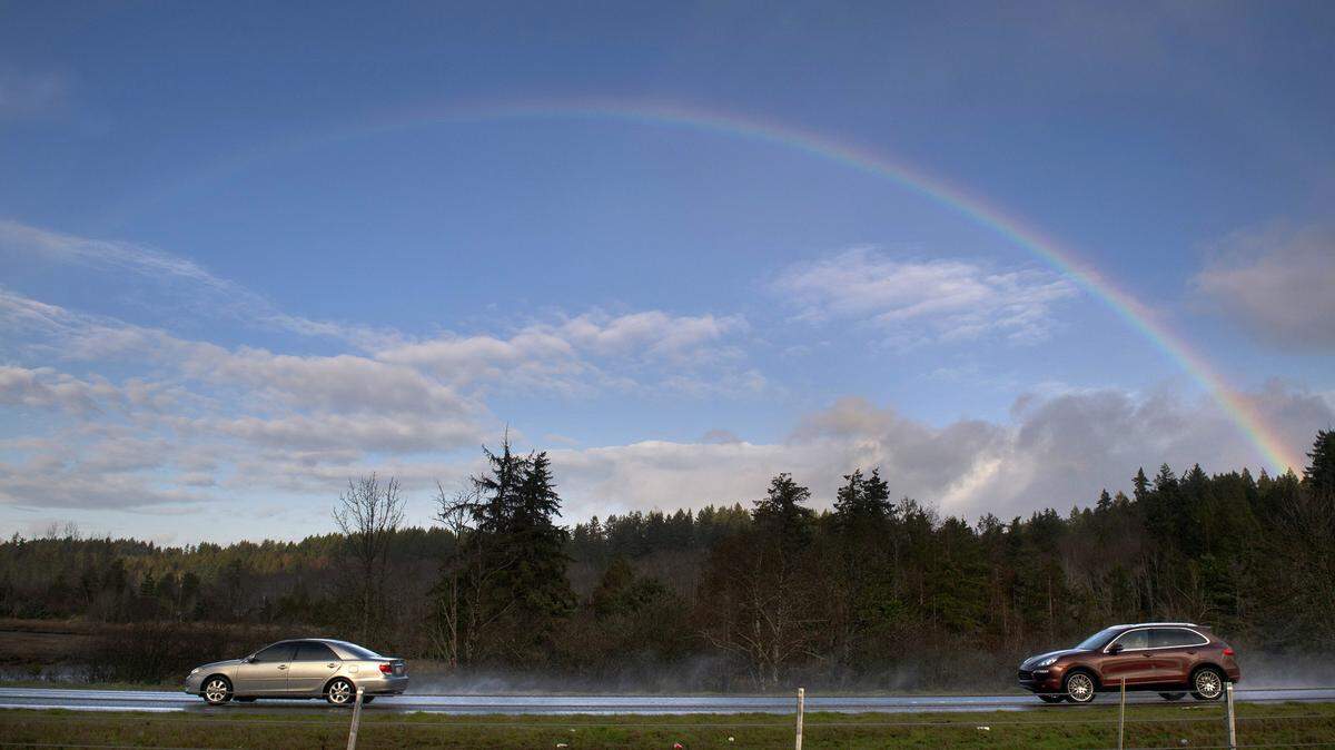 A rainbow shines over Highway 101 at Mud Bay west of Olympia in 2020.